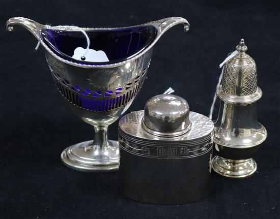 An Adam style silver sugar vase with blue glass liner, a small silver tea oval caddy and a large baluster pepper